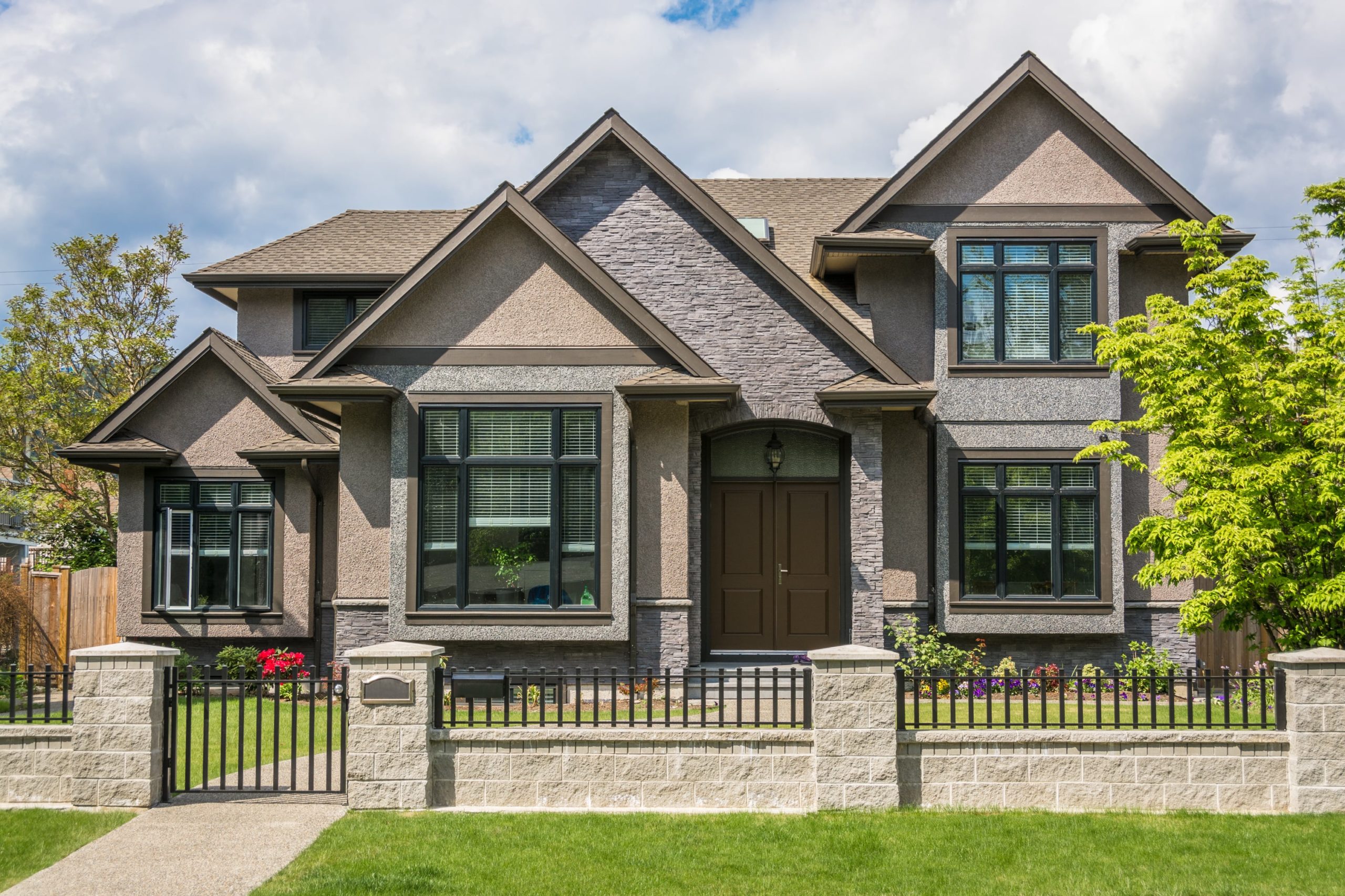 Upscale home with brick gate